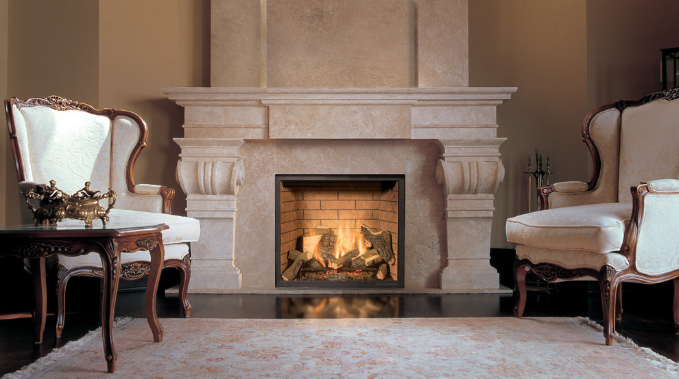 This is an example of a traditional living room in Denver with beige walls, dark hardwood floors, a standard fireplace and a stone fireplace surround.