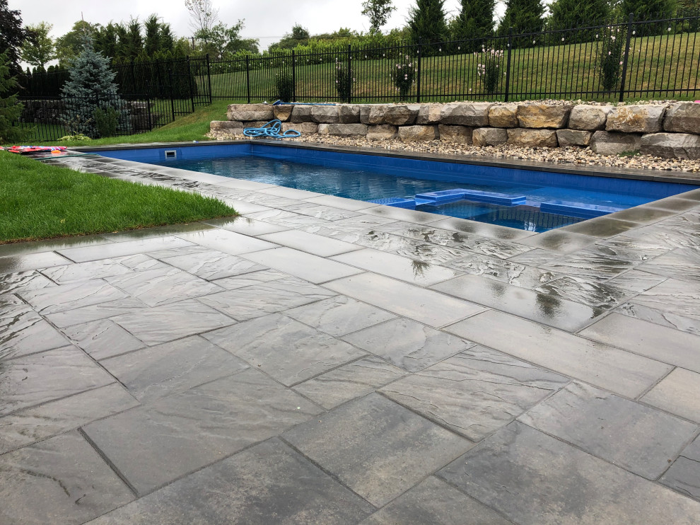 Inspiration for a rustic pool remodel in Toronto