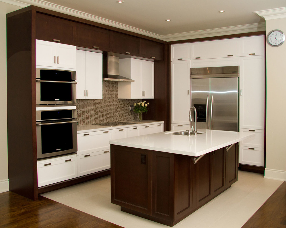 This is an example of a large modern galley eat-in kitchen in Toronto with an undermount sink, beaded inset cabinets, white cabinets, quartzite benchtops, beige splashback, subway tile splashback, panelled appliances, travertine floors and with island.
