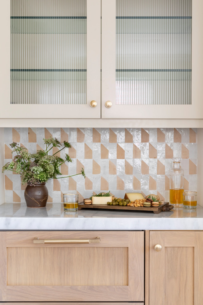 Inspiration for a transitional home bar remodel in Orange County