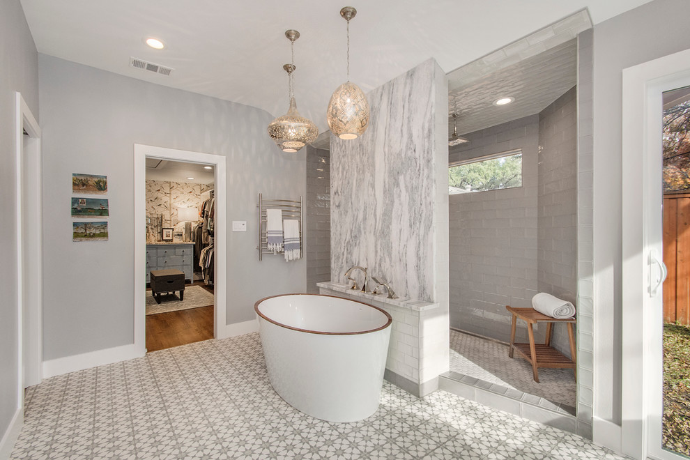 This is an example of a large eclectic master bathroom in Dallas with flat-panel cabinets, light wood cabinets, a freestanding tub, an open shower, a two-piece toilet, gray tile, cement tile, grey walls, cement tiles, an undermount sink and quartzite benchtops.