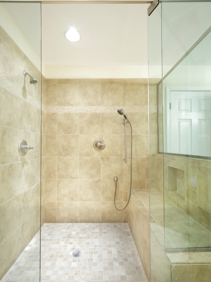 Design ideas for a mid-sized transitional master bathroom in Birmingham with shaker cabinets, white cabinets, a corner shower, a two-piece toilet, beige tile, porcelain tile, beige walls and porcelain floors.
