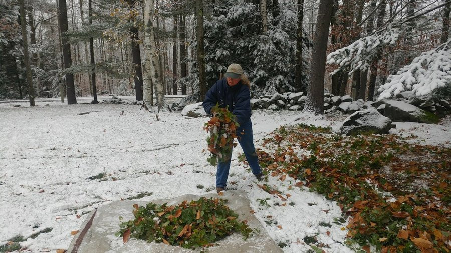 Cleaning up the Garden after first snow fall by Peter Atkins and Associates