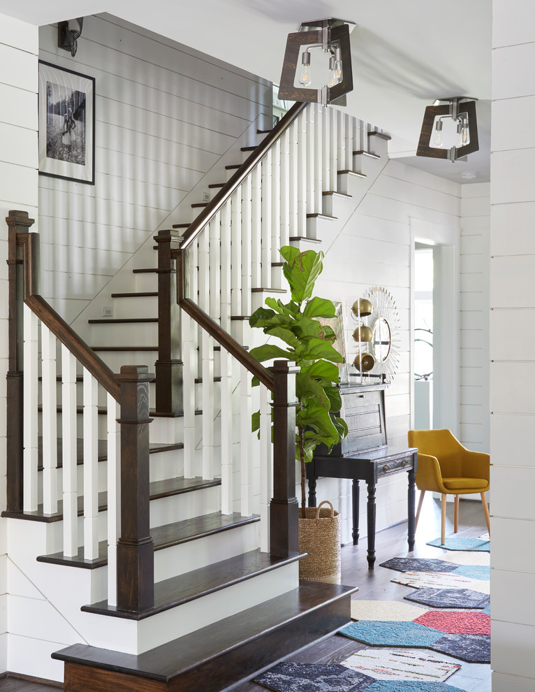 Design ideas for a mid-sized country wood l-shaped staircase in Houston with painted wood risers and wood railing.