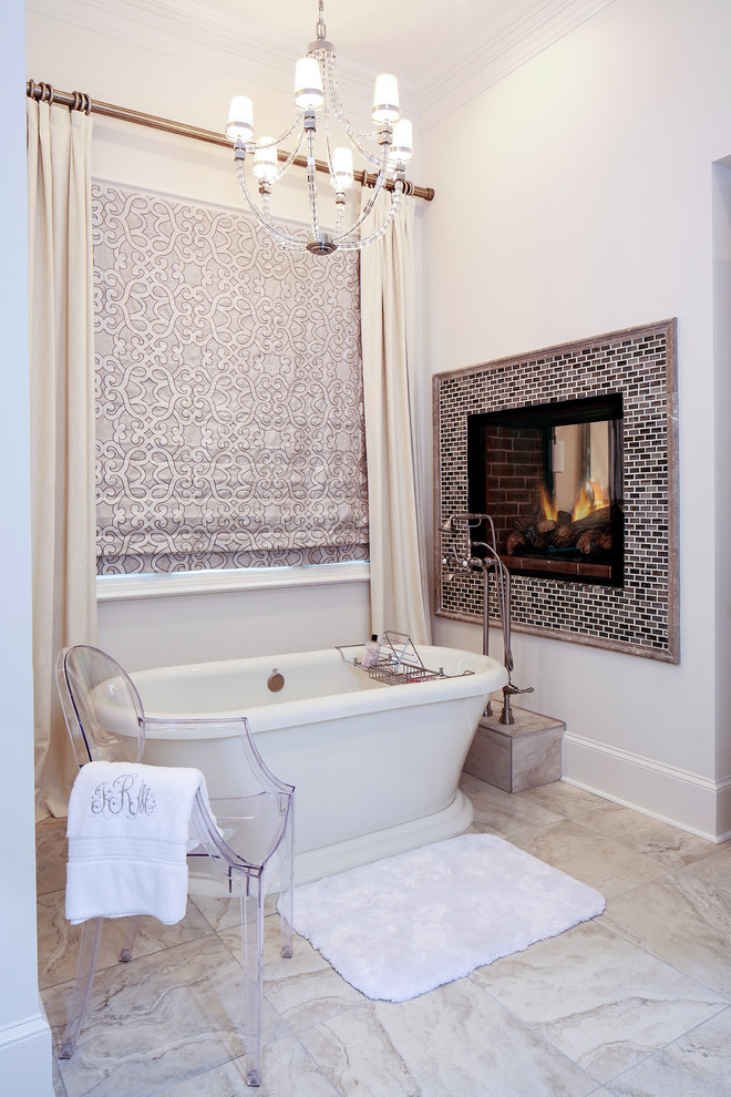 Design ideas for a transitional bathroom in Nashville with a freestanding tub and white tile.
