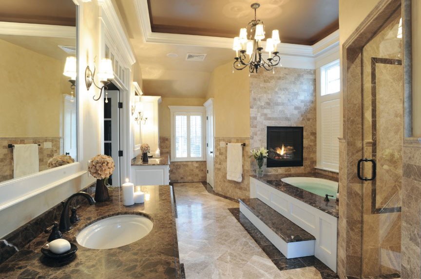Inspiration for a large traditional master bathroom in San Francisco with marble benchtops, brown tile, beige tile, black tile, white tile, raised-panel cabinets, white cabinets, an undermount tub, an alcove shower, a two-piece toilet, subway tile, beige walls, marble floors and an undermount sink.