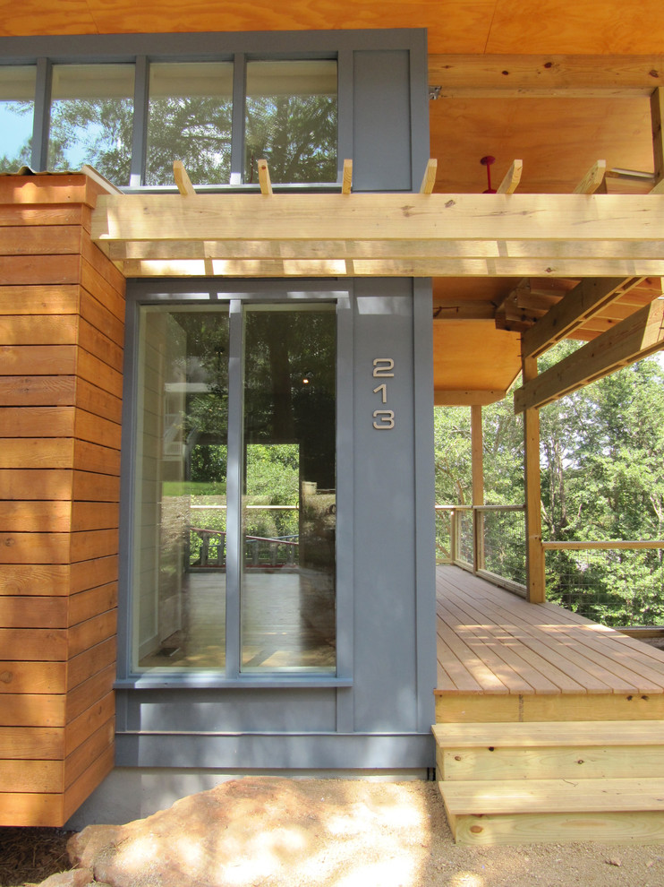 Inspiration for a modern blue exterior in Atlanta with wood siding.