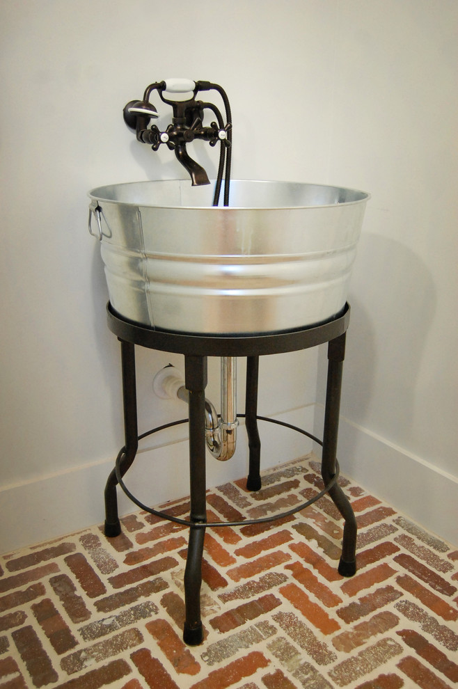 Inspiration for a country laundry room in Atlanta with an utility sink.