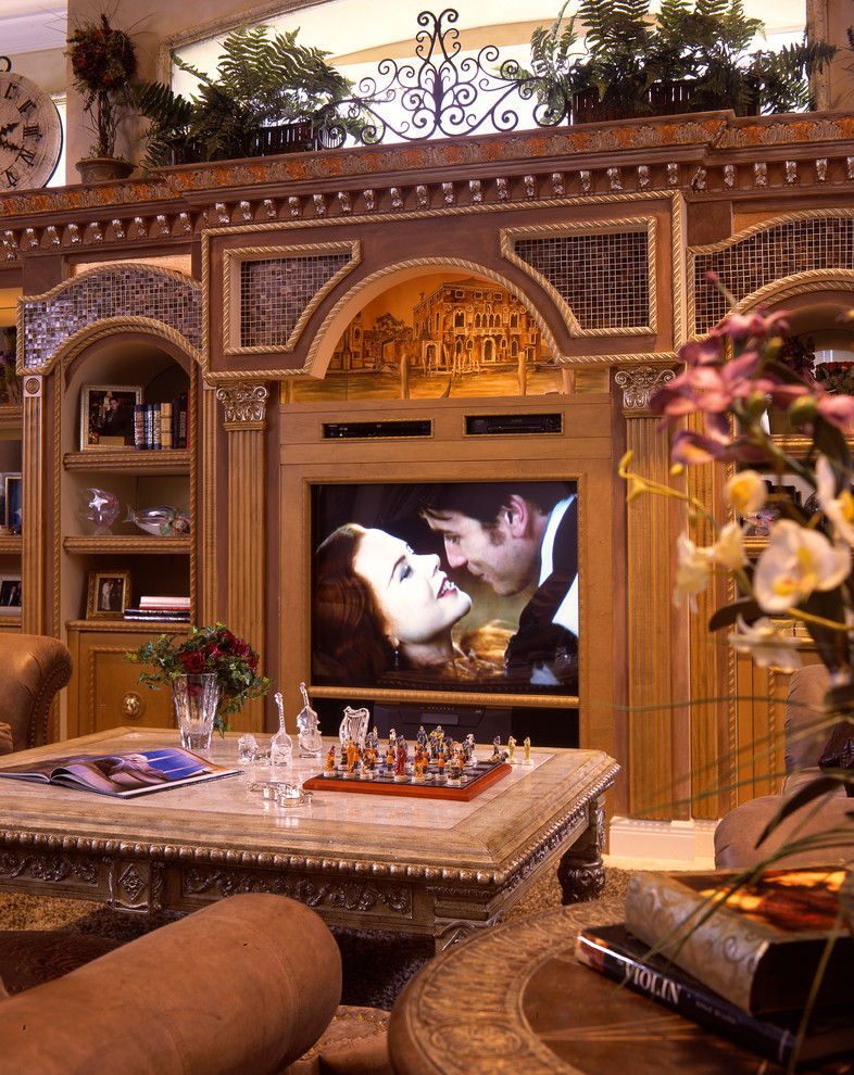 This is an example of a mediterranean family room in Miami with a built-in media wall.