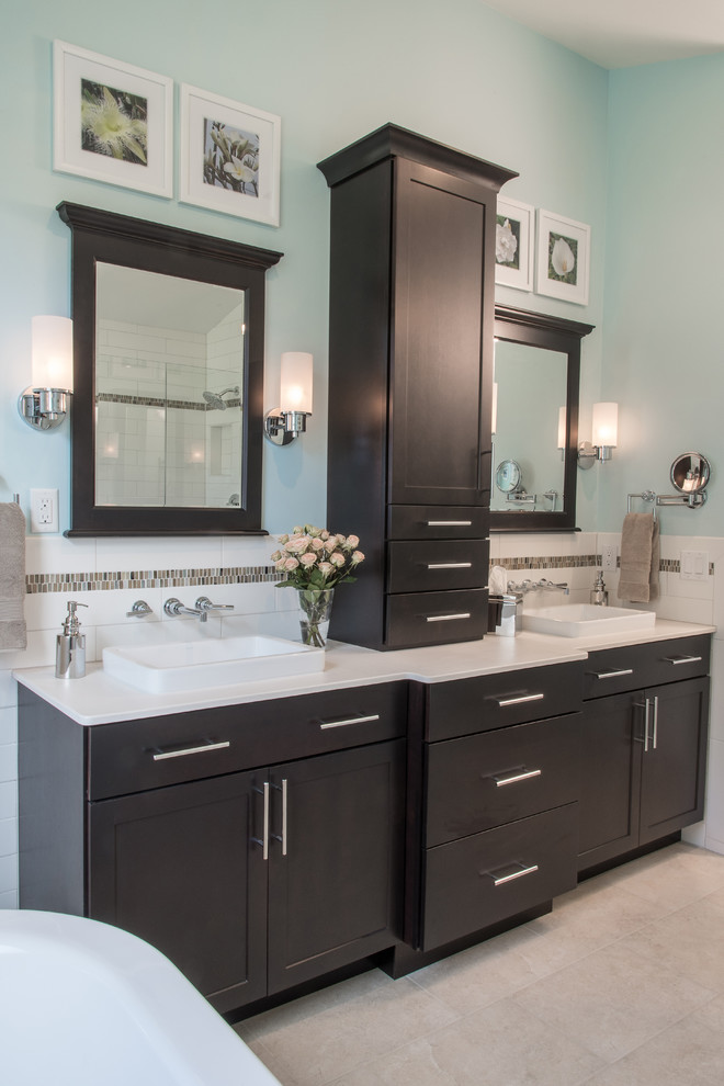Large transitional master bathroom in St Louis with shaker cabinets, beige cabinets, a freestanding tub, beige tile, porcelain tile, ceramic floors and onyx benchtops.