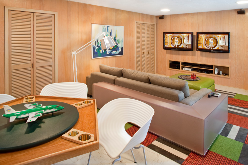 This is an example of a large midcentury walk-out basement in Atlanta with beige walls and linoleum floors.