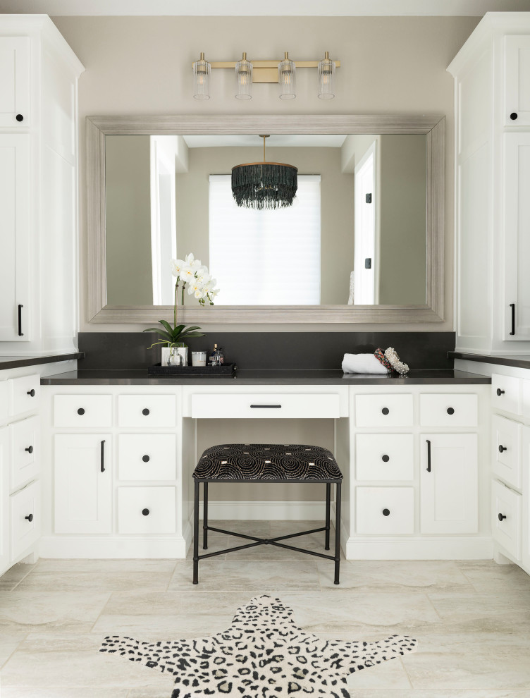 Inspiration for a traditional ensuite bathroom in Dallas with white cabinets, beige walls, beige floors, black worktops and a built in vanity unit.