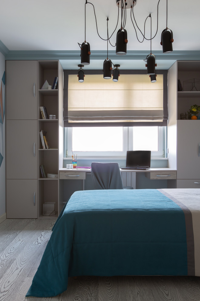 На фото: детская среднего размера: освещение в современном стиле с рабочим местом, синими стенами, пробковым полом, серым полом, многоуровневым потолком и панелями на стенах для подростка, мальчика