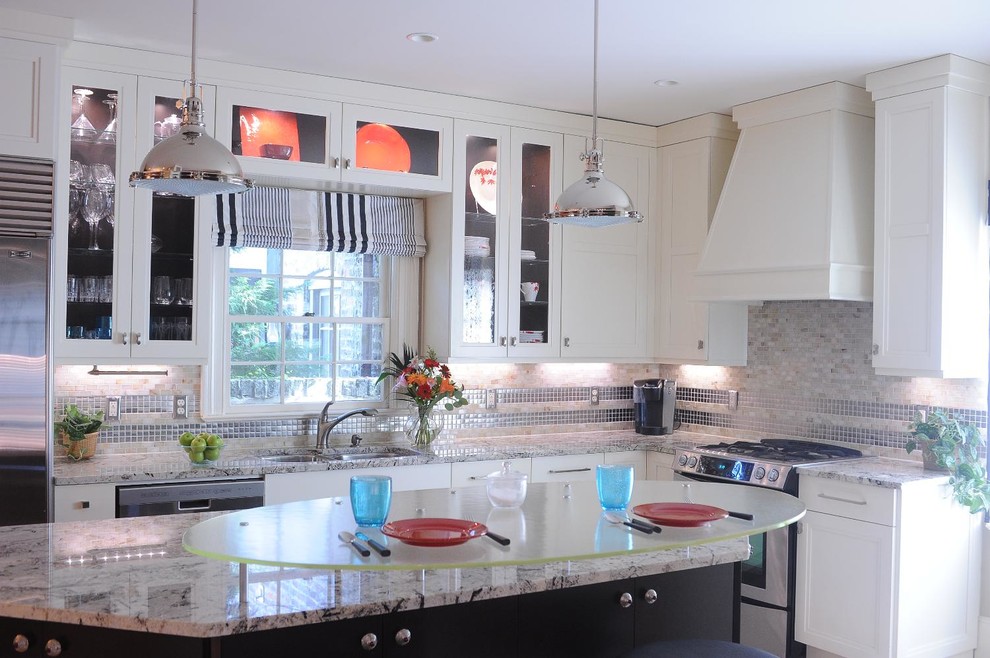 Example of a large transitional u-shaped kitchen design with flat-panel cabinets, white cabinets and an island