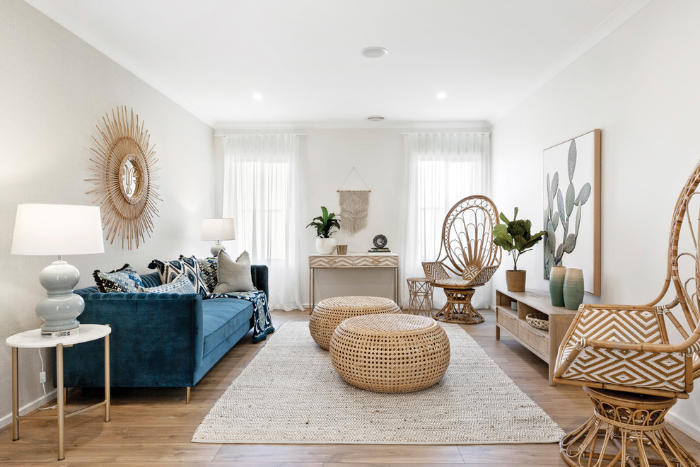 Design ideas for a beach style living room in Melbourne with grey walls, medium hardwood floors and brown floor.