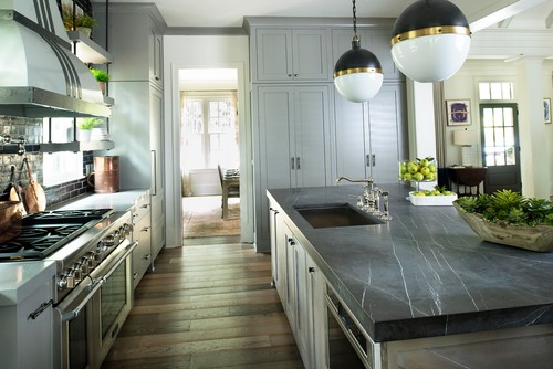 A kitchen designed by Huff Harrington Home featuring gray-honed marble