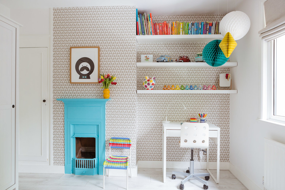 This is an example of a mid-sized scandinavian gender-neutral kids' study room for kids 4-10 years old in Other with white walls, laminate floors and white floor.