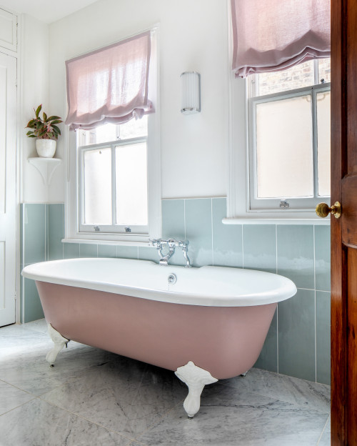 Pink Clawfoot Bathtub with Pastel Blue Wall Tiles