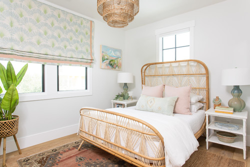 boho beach bedroom style with rattan bedframe and natural decor, beach themed bedroom 