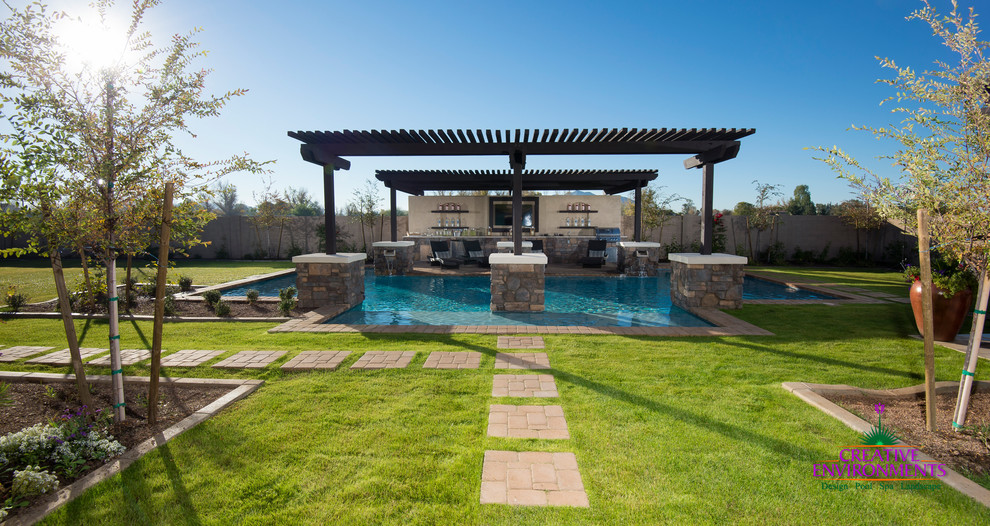 Inspiration for a huge modern backyard stamped concrete and custom-shaped infinity home design remodel in Phoenix