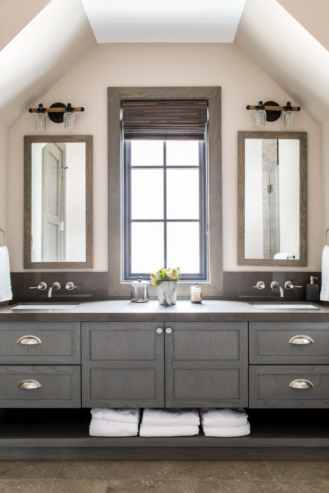 This is an example of a transitional bathroom in New York with shaker cabinets, dark wood cabinets, beige walls, an undermount sink, brown floor, brown benchtops, a double vanity and a built-in vanity.