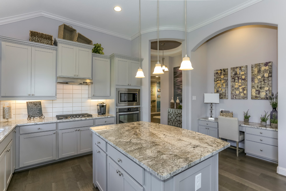 Design ideas for a mid-sized l-shaped eat-in kitchen in Houston with a double-bowl sink, recessed-panel cabinets, grey cabinets, granite benchtops, white splashback, subway tile splashback, stainless steel appliances, dark hardwood floors, with island and purple floor.