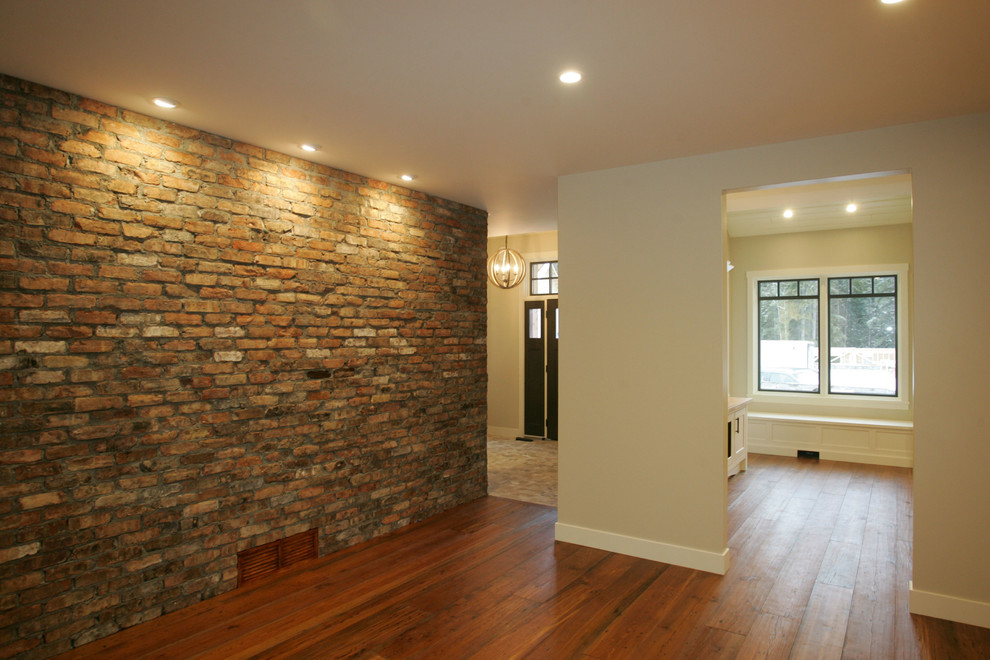 Single front door - transitional medium tone wood floor single front door idea in Calgary with a black front door