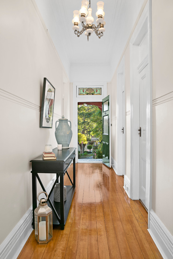 Design ideas for a large traditional hallway in Sydney with white walls and light hardwood floors.