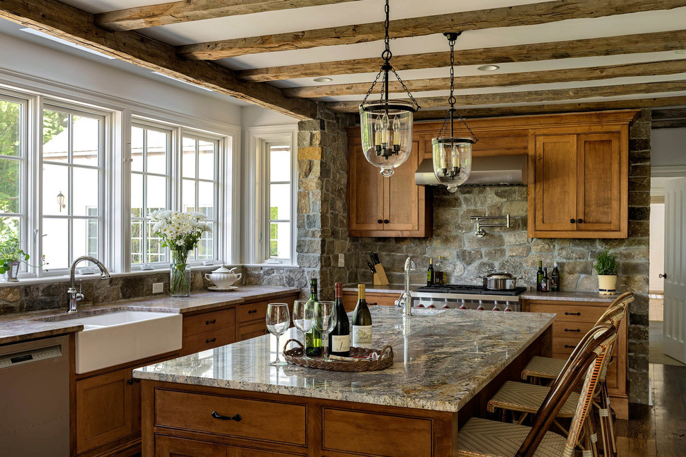 Inspiration for a large traditional u-shaped open plan kitchen in Bridgeport with a farmhouse sink, shaker cabinets, medium wood cabinets, granite benchtops, grey splashback, stone tile splashback, stainless steel appliances, medium hardwood floors, with island and brown floor.