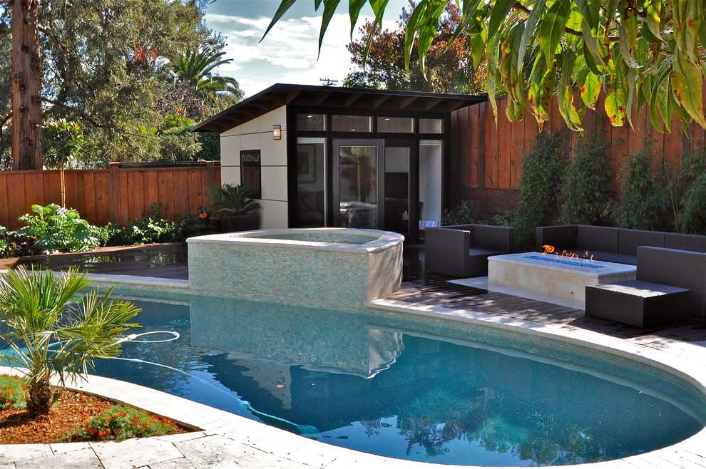 Contemporary backyard kidney-shaped pool in San Francisco with tile and a hot tub.