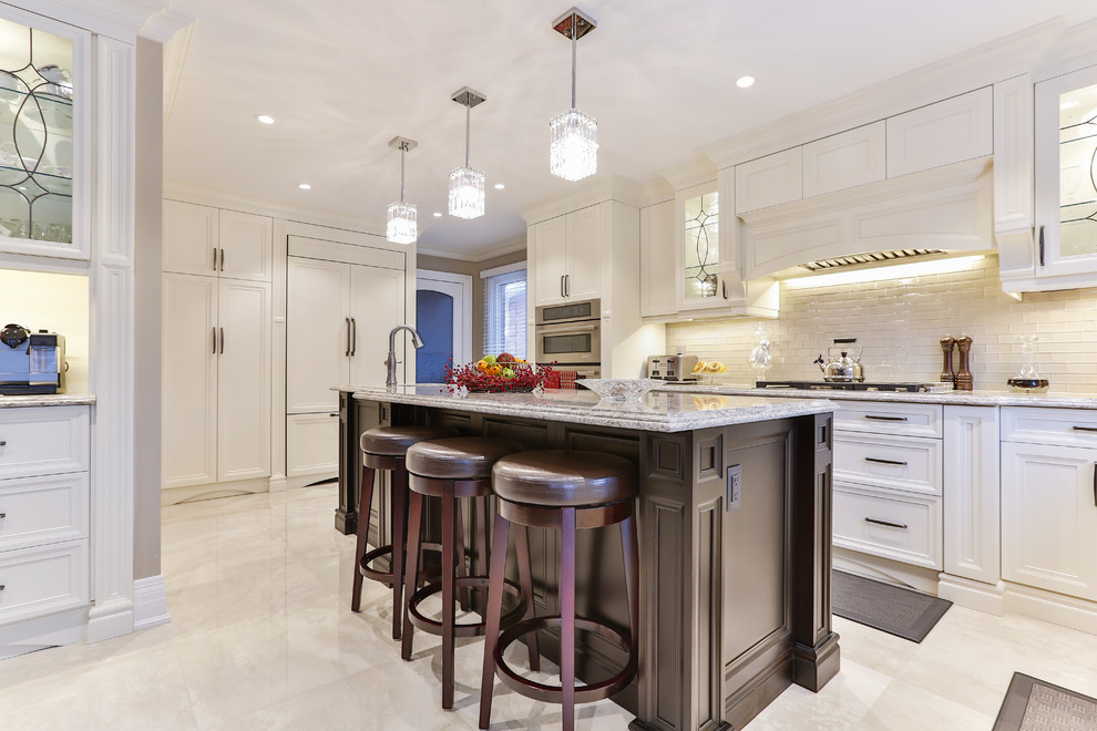 Example of a transitional kitchen design in Toronto