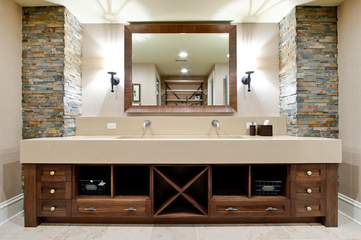 Photo of an expansive traditional kids bathroom in Atlanta with a trough sink, open cabinets, medium wood cabinets, concrete benchtops, a corner shower, a one-piece toilet, beige tile, brown walls and travertine floors.