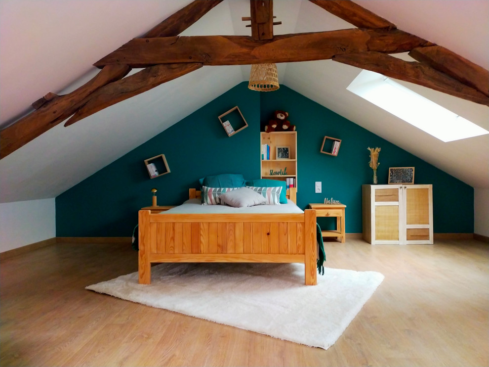 This is an example of a medium sized contemporary mezzanine bedroom in Other with green walls, light hardwood flooring and exposed beams.