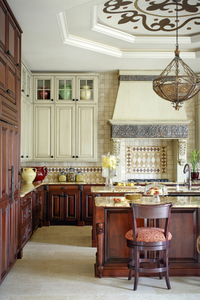 Inspiration for a mediterranean kitchen in Little Rock with raised-panel cabinets, beige cabinets and beige splashback.