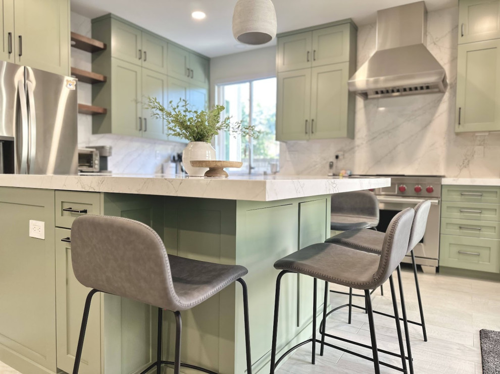 Inspiration for a mid-sized transitional galley kitchen pantry in Orange County with an undermount sink, shaker cabinets, green cabinets, laminate benchtops, white splashback, stainless steel appliances, ceramic floors, with island, multi-coloured floor, white benchtop and vaulted.