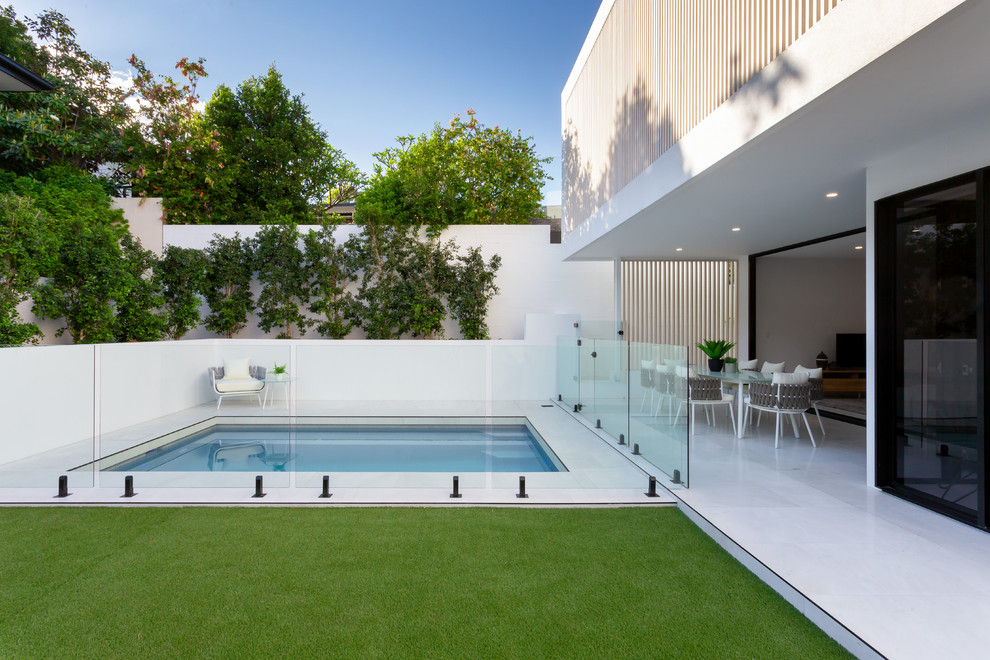 Design ideas for a small contemporary rectangular pool in Brisbane with tile.