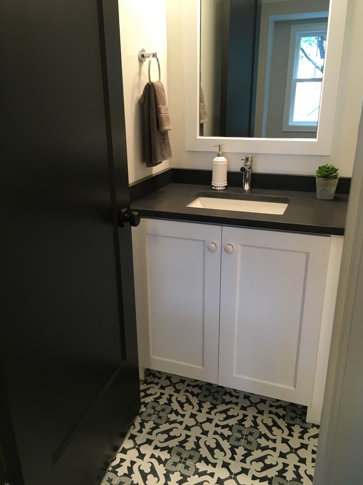 Example of a mid-sized transitional kids' white tile and ceramic tile porcelain tile and multicolored floor home design design in Chicago with shaker cabinets, white cabinets, a two-piece toilet, gray walls, an undermount sink, quartz countertops and black countertops