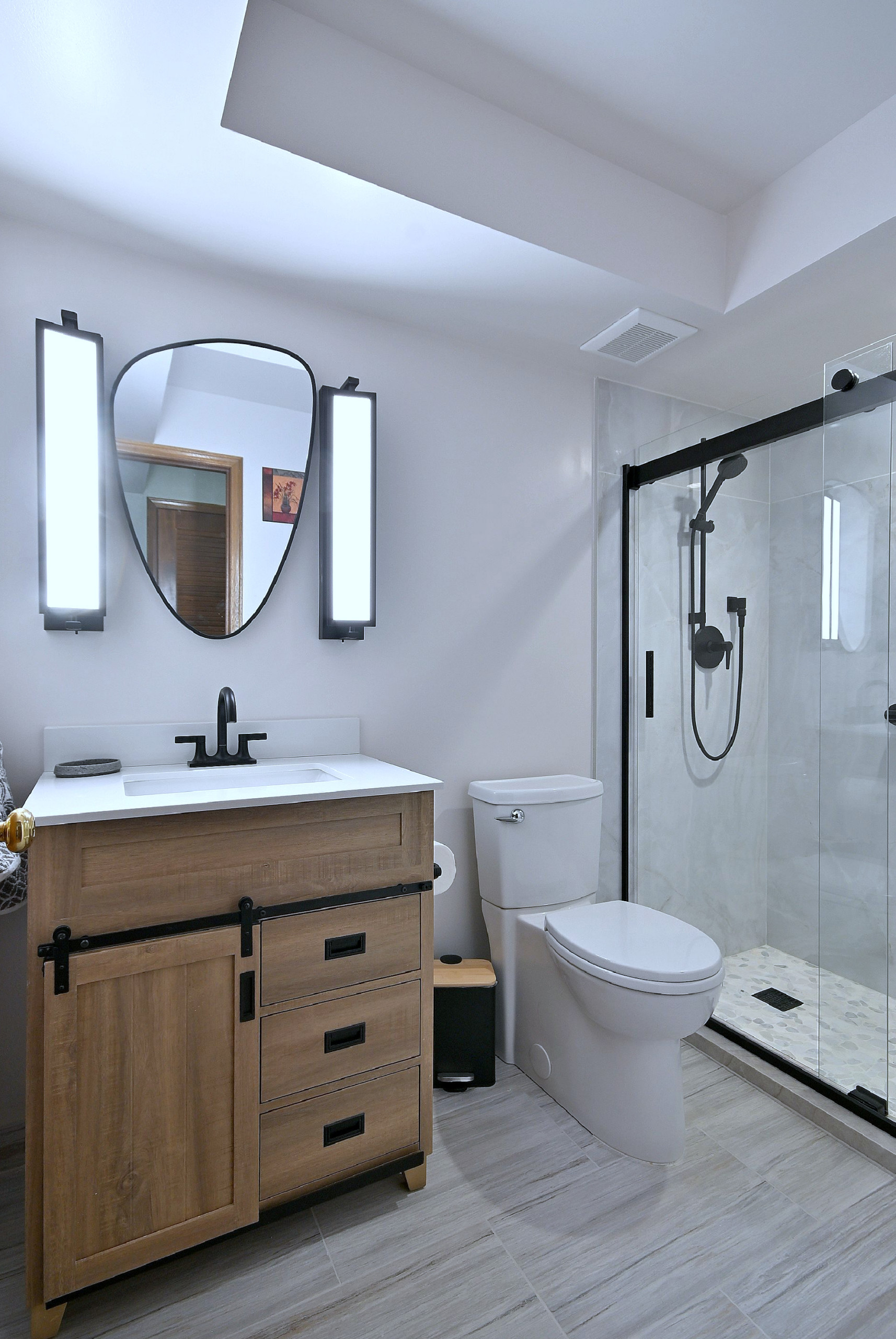 Modern Transitional Bathroom with Sliding Barn Door Vanity