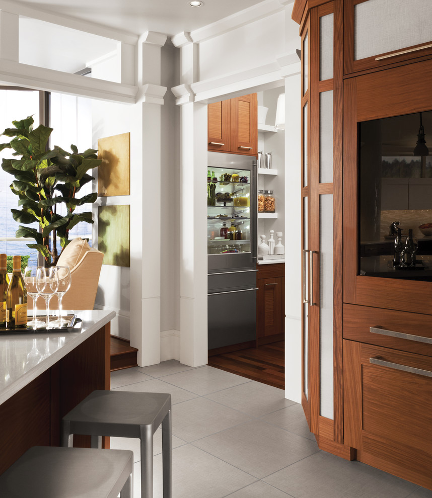 Open concept kitchen - mid-sized transitional l-shaped porcelain tile and beige floor open concept kitchen idea with stainless steel appliances, shaker cabinets, dark wood cabinets, quartz countertops and an island
