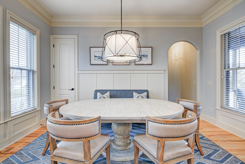 Inspiration for a mid-sized transitional medium tone wood floor and beige floor enclosed dining room remodel in Indianapolis with no fireplace and gray walls