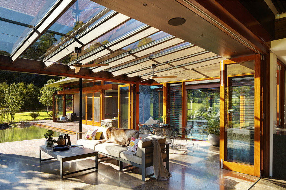 Large asian sunroom in Perth with a skylight.