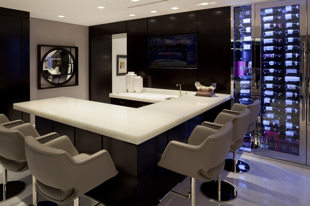 Large contemporary u-shaped seated home bar in Miami with quartzite benchtops, marble floors, white floor and white benchtop.
