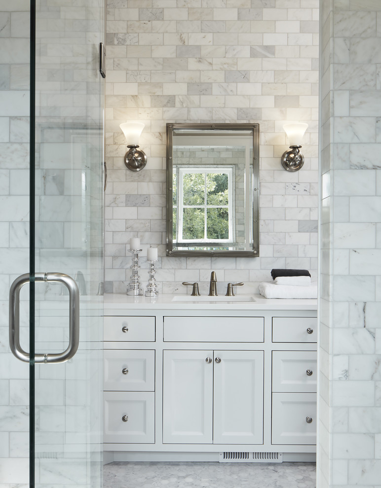 Mid-sized country master bathroom in Minneapolis with white cabinets, an alcove shower, marble floors, beaded inset cabinets, a two-piece toilet, white tile, stone tile, grey walls, an undermount sink, engineered quartz benchtops and white benchtops.