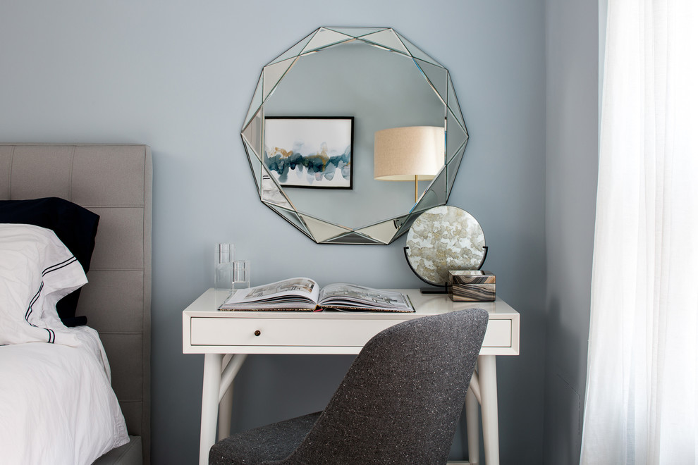 Small trendy bedroom photo in New York with blue walls