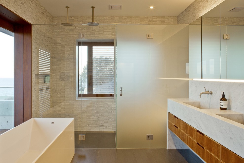 Large contemporary master bathroom in Sydney with medium wood cabinets, marble benchtops, a wall-mount toilet, gray tile, mosaic tile, grey walls and slate floors.