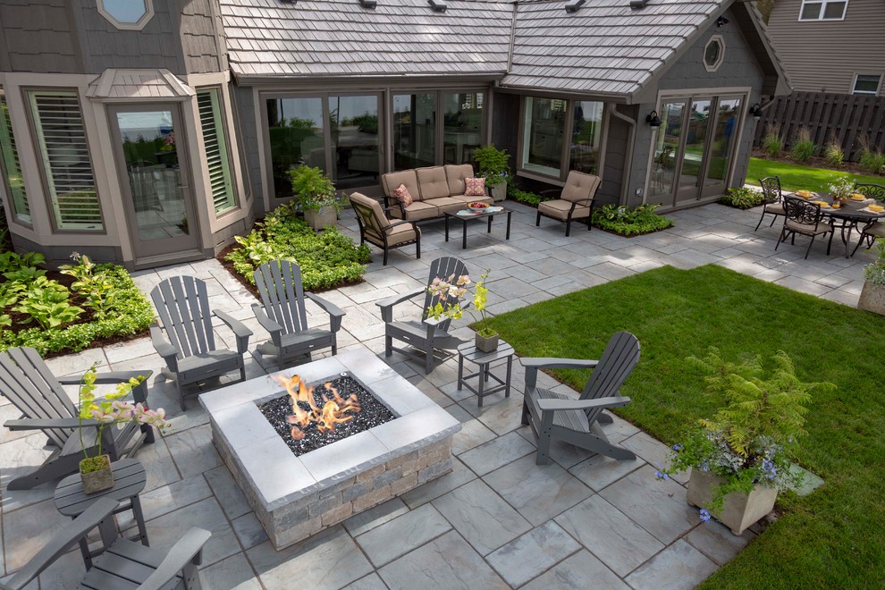 Mid-sized arts and crafts backyard concrete paver patio photo in Chicago with a fire pit and no cover