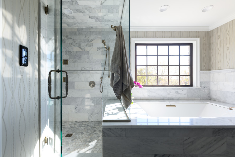 Mid-sized transitional master white tile and marble tile marble floor and white floor corner shower photo with raised-panel cabinets, dark wood cabinets, an undermount tub, gray walls, an undermount sink, quartzite countertops, a hinged shower door and white countertops