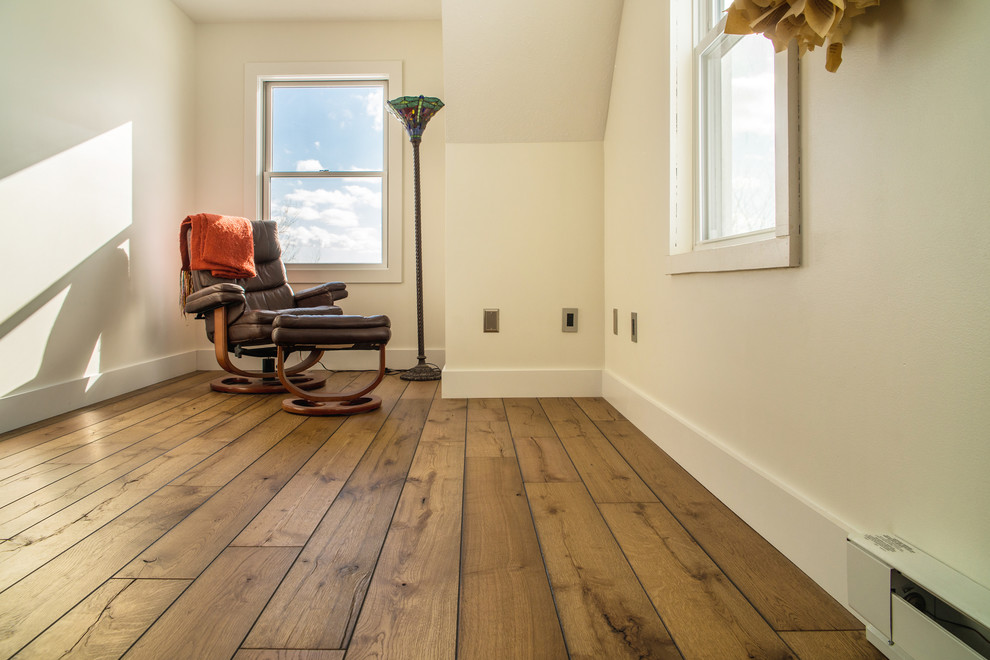 Design ideas for a country home office in Boston with light hardwood floors.