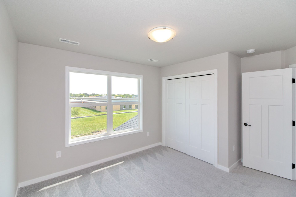 Inspiration for a small transitional guest carpeted and gray floor bedroom remodel with gray walls