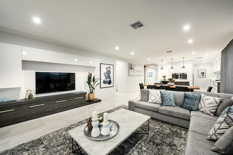 Large contemporary open concept living room in Perth with white walls, porcelain floors and a wall-mounted tv.